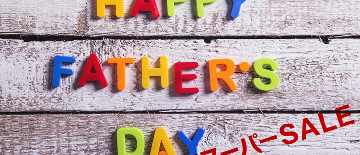 Colorful Happy fathers day sign on a white wooden background.